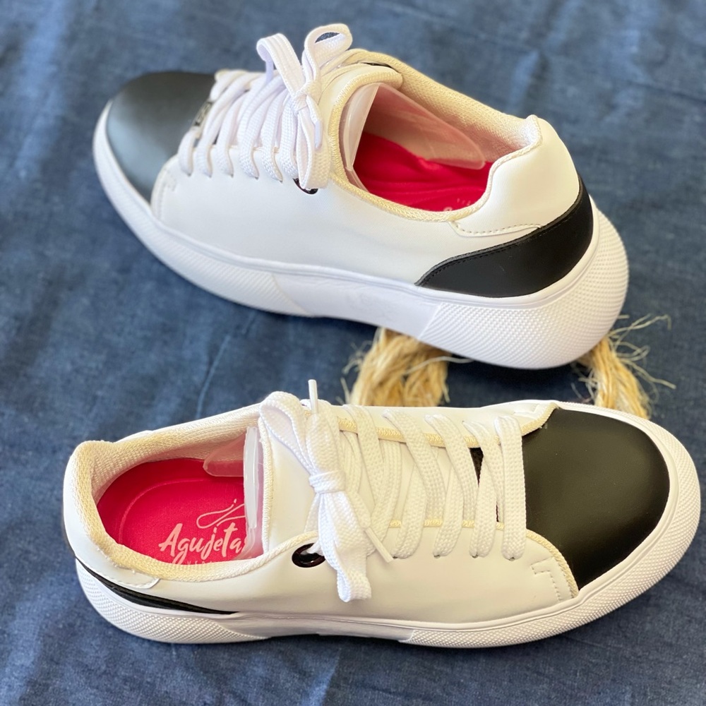 Tennis shoes, new no tags, size 7 only one pair, leather.
